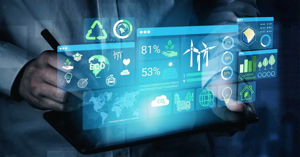 Hand using a stylus on a tablet beneath a holographic dashboard displaying energy data and analytics.